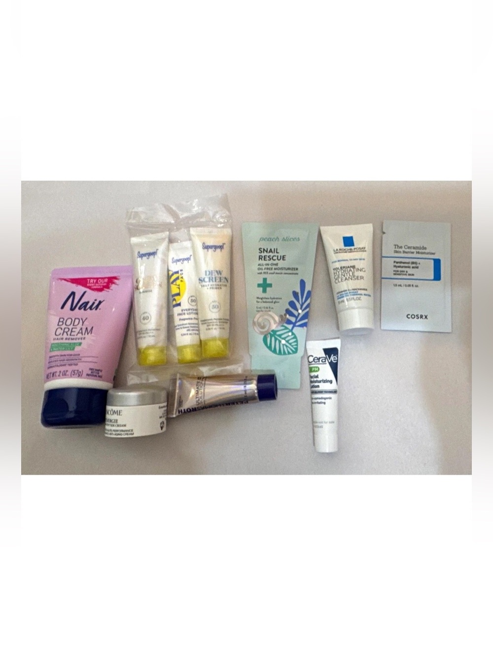 Assorted Travel/Sample Skincare Lot Nair, Lancôme Rénergie, Supergoop, COSRX